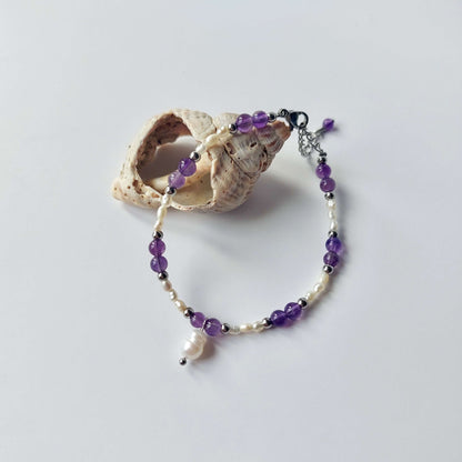 bracelet pour femme en acier inoxydable argenté perles d'eau douce et pierre améthyste violette
